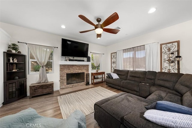 717 Lingel Dr, El Cajon, CA 92019 - living area featuring a ceiling fan, a fireplace, wood finished floors, and recessed lighting