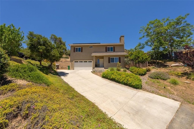 717 Lingel Dr, El Cajon, CA 92019 - mediterranean / spanish home featuring a chimney, stucco siding, concrete driveway, an attached garage, and a tiled roof