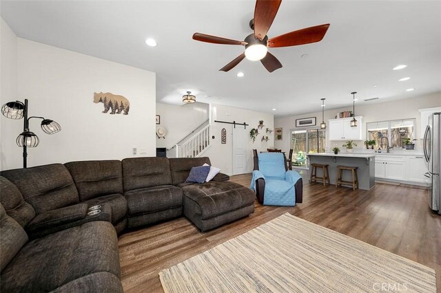 717 Lingel Dr, El Cajon, CA 92019 - living room with stairs, a ceiling fan, wood finished floors, recessed lighting, and a barn door