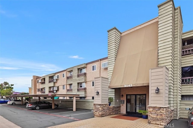 3142 Midway Dr Unit 312, San Diego, CA 92110 - view of building exterior featuring covered parking