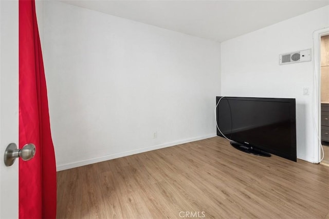 3142 Midway Dr Unit 312, San Diego, CA 92110 - spare room featuring wood finished floors and baseboards