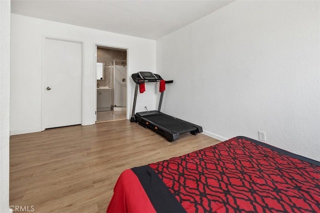 3142 Midway Dr Unit 312, San Diego, CA 92110 - bedroom featuring wood finished floors and connected bathroom