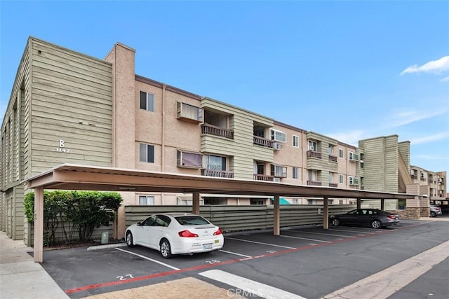 3142 Midway Dr Unit 312, San Diego, CA 92110 - view of building exterior with covered parking