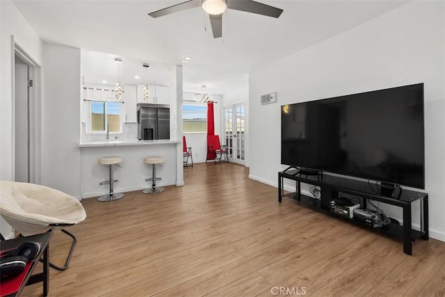 3142 Midway Dr Unit 312, San Diego, CA 92110 - living area with a ceiling fan and light wood finished floors