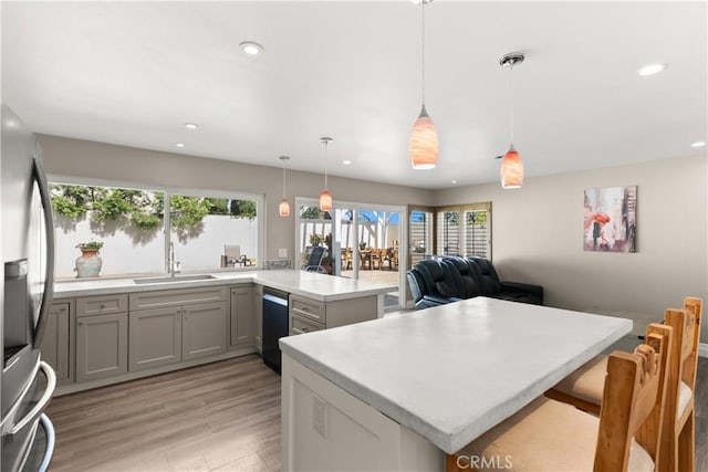 2040 Cape Cod Ct, Claremont, CA 91711 - kitchen featuring healthy amount of natural light, recessed lighting, black dishwasher, light wood-style flooring, and light countertops