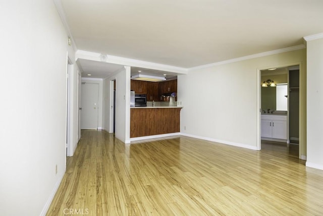 700 E Ocean Blvd Unit 2606, Long Beach, CA 90802 - unfurnished living room featuring light wood finished floors and ornamental molding