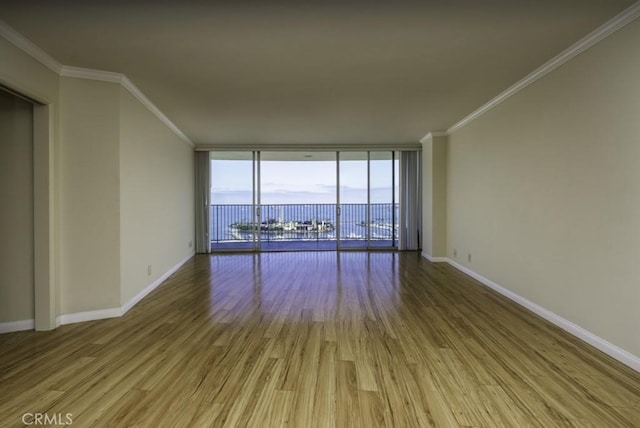700 E Ocean Blvd Unit 2606, Long Beach, CA 90802 - unfurnished room featuring ornamental molding, wood finished floors, and floor to ceiling windows