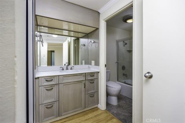 700 E Ocean Blvd Unit 2606, Long Beach, CA 90802 - bathroom featuring vanity, wood finished floors, shower / bath combination with glass door, and ornamental molding