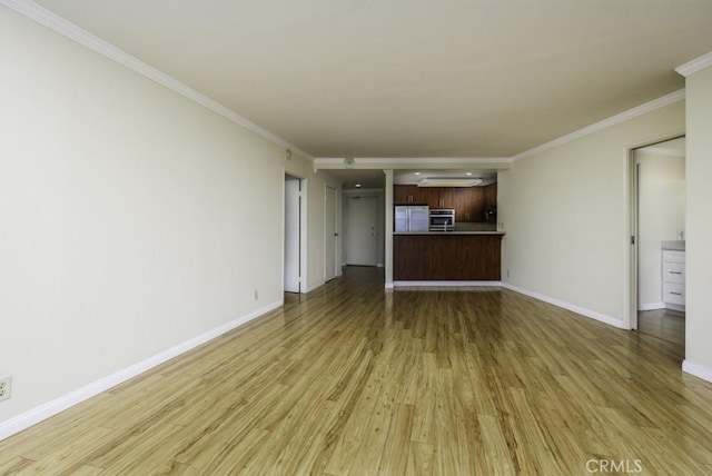 700 E Ocean Blvd Unit 2606, Long Beach, CA 90802 - unfurnished living room with light wood-style floors and crown molding
