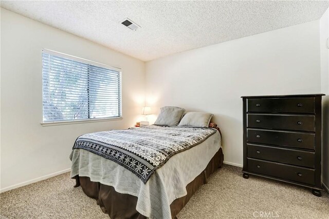 4565 Alamo St Unit H, Simi Valley, CA 93063 - bedroom with carpet flooring and a textured ceiling