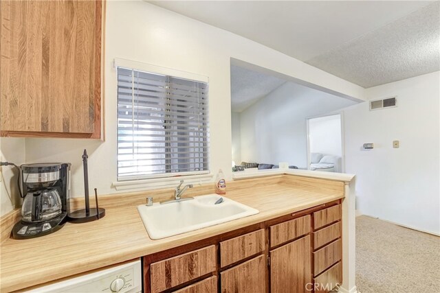 4565 Alamo St Unit H, Simi Valley, CA 93063 - kitchen with white dishwasher, light countertops, carpet, and open floor plan
