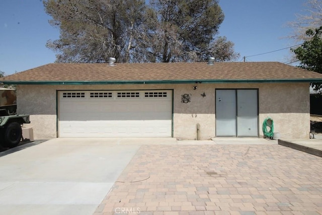 38103 Dividing Line St, Yermo, CA 92398 - view of front facade with stucco siding, driveway, roof with shingles, and a garage