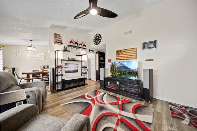 28927 Rue Daniel Cyn, Country, CA 91387 - living room featuring a textured ceiling, ceiling fan, wood finished floors, and vaulted ceiling