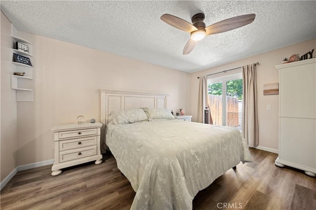 28927 Rue Daniel Cyn, Country, CA 91387 - bedroom featuring access to exterior, dark wood-style flooring, a textured ceiling, and ceiling fan