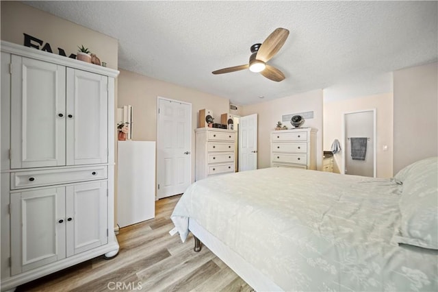 28927 Rue Daniel Cyn, Country, CA 91387 - bedroom featuring light wood finished floors, a textured ceiling, and a ceiling fan