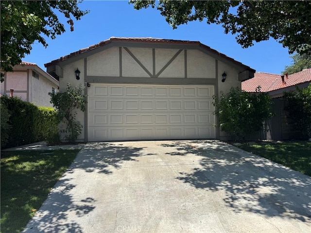 28927 Rue Daniel Cyn, Country, CA 91387 - view of front of home with an attached garage, concrete driveway, and stucco siding