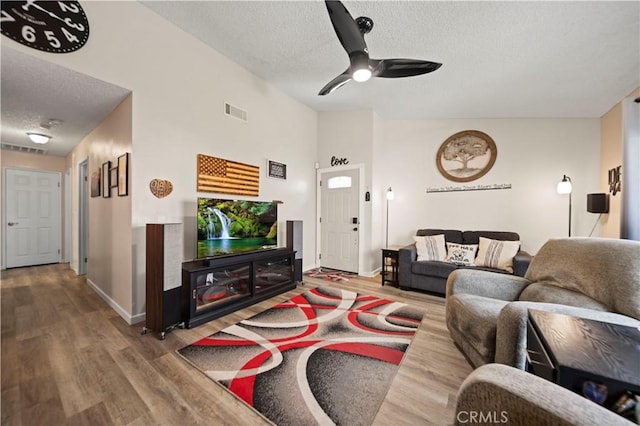 28927 Rue Daniel Cyn, Country, CA 91387 - living room featuring a textured ceiling, wood finished floors, and a ceiling fan