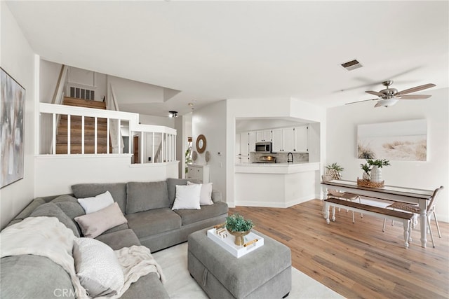 36 Via Madera, Rancho Santa Margarita, CA 92688 - living room with light wood-style floors, stairway, and a ceiling fan