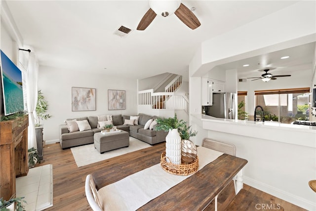 36 Via Madera, Rancho Santa Margarita, CA 92688 - living area with ceiling fan, stairway, wood finished floors, recessed lighting, and a tile fireplace