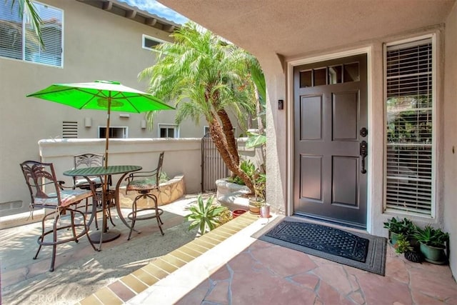 26181 San Marino Ct, Mission Viejo, CA 92692 - doorway to property with stucco siding and a patio area