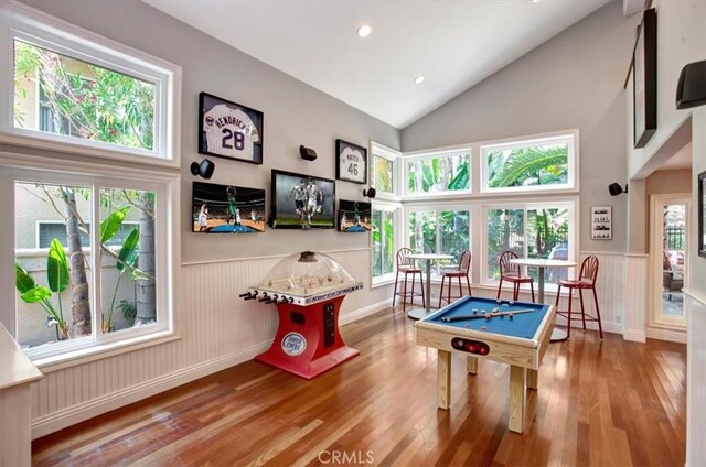 26181 San Marino Ct, Mission Viejo, CA 92692 - rec room with billiards table, wainscoting, wood finished floors, recessed lighting, and high vaulted ceiling