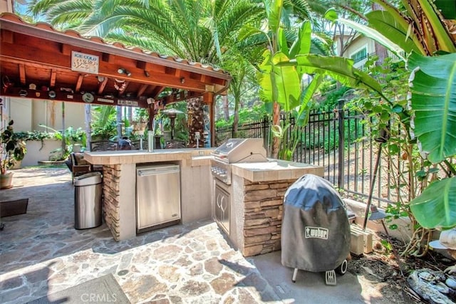 26181 San Marino Ct, Mission Viejo, CA 92692 - fenced backyard with exterior kitchen, an outdoor bar, a patio area, and a gazebo
