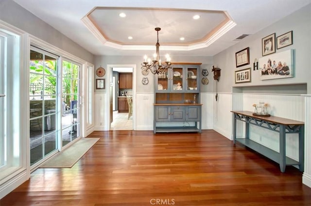 26181 San Marino Ct, Mission Viejo, CA 92692 - unfurnished dining area featuring a chandelier, wood finished floors, a wainscoted wall, a tray ceiling, and recessed lighting