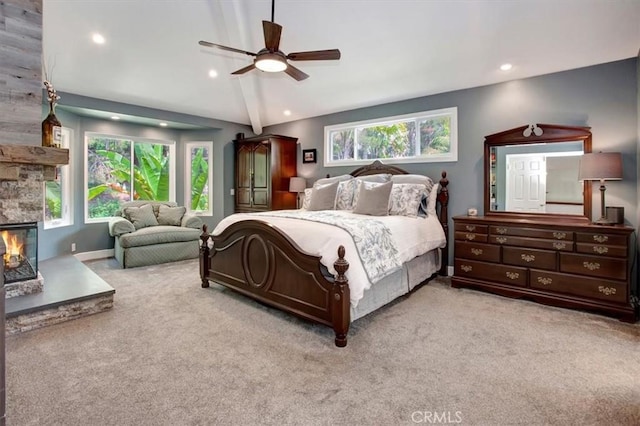 26181 San Marino Ct, Mission Viejo, CA 92692 - carpeted bedroom featuring vaulted ceiling, recessed lighting, a ceiling fan, and a stone fireplace