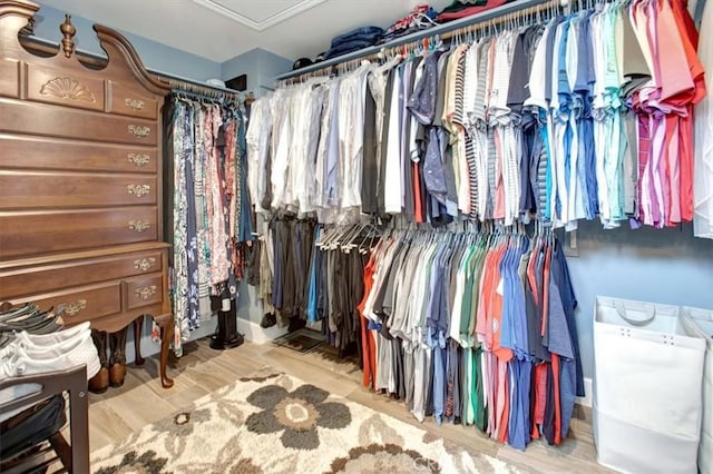 26181 San Marino Ct, Mission Viejo, CA 92692 - walk in closet with wood finished floors