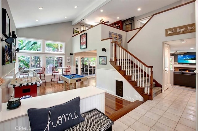 26181 San Marino Ct, Mission Viejo, CA 92692 - living area with a ceiling fan, beam ceiling, stairway, wood finished floors, and wainscoting