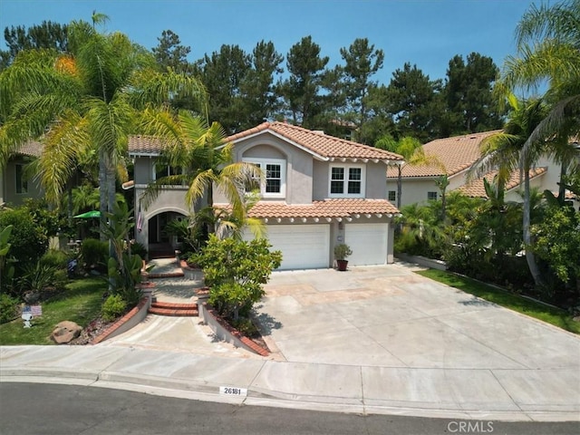 26181 San Marino Ct, Mission Viejo, CA 92692 - mediterranean / spanish-style home with a tiled roof, stucco siding, a garage, and concrete driveway