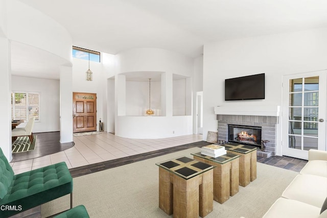 800 Manor Ridge Rd, Santa Paula, CA 93060 - living room with plenty of natural light, wood finished floors, a fireplace, and high vaulted ceiling