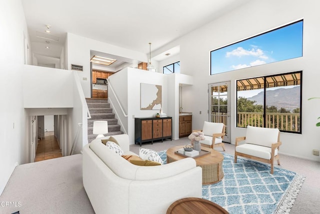 800 Manor Ridge Rd, Santa Paula, CA 93060 - carpeted living room with a high ceiling and stairs