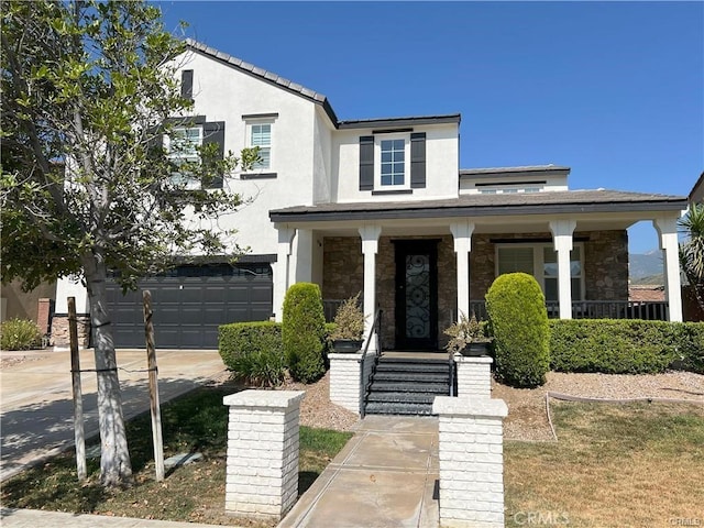 4866 Stoneglen Ave, Fontana, CA 92336 - view of front facade with an attached garage, stucco siding, concrete driveway, a porch, and stone siding
