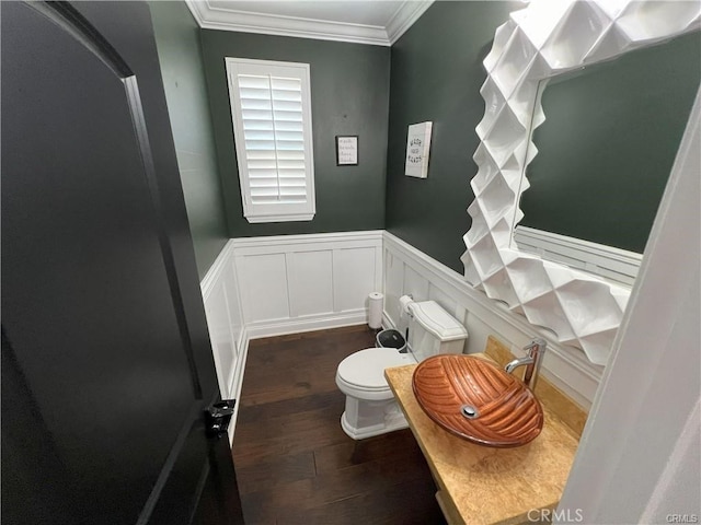 4866 Stoneglen Ave, Fontana, CA 92336 - half bathroom with wood finished floors, ornamental molding, a wainscoted wall, and a decorative wall