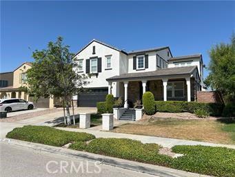 4866 Stoneglen Ave, Fontana, CA 92336 - view of front of home featuring covered porch