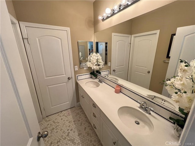 4866 Stoneglen Ave, Fontana, CA 92336 - full bath with double vanity and tile patterned flooring