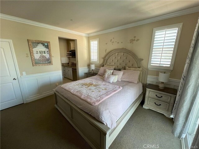 4866 Stoneglen Ave, Fontana, CA 92336 - carpeted bedroom featuring multiple windows, ornamental molding, a wainscoted wall, and ensuite bathroom