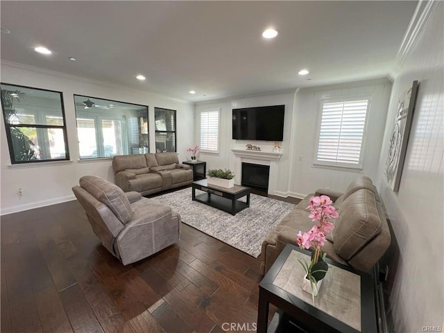 4866 Stoneglen Ave, Fontana, CA 92336 - living area with ornamental molding, dark wood finished floors, a fireplace, recessed lighting, and a ceiling fan