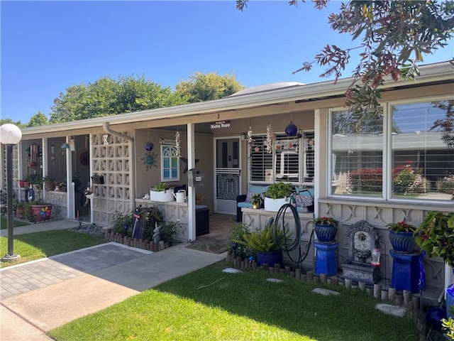 1271 Kenwood Rd Unit M7-J, Seal Beach, CA 90740 - view of front of property featuring a porch