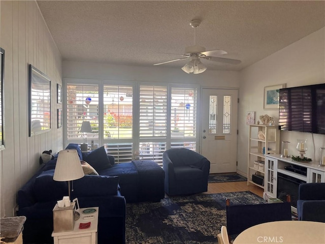 1271 Kenwood Rd Unit M7-J, Seal Beach, CA 90740 - living room featuring ceiling fan, a textured ceiling, and wood finished floors