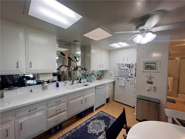 1271 Kenwood Rd Unit M7-J, Seal Beach, CA 90740 - full bath with a ceiling fan, wood finished floors, vanity, and an enclosed shower