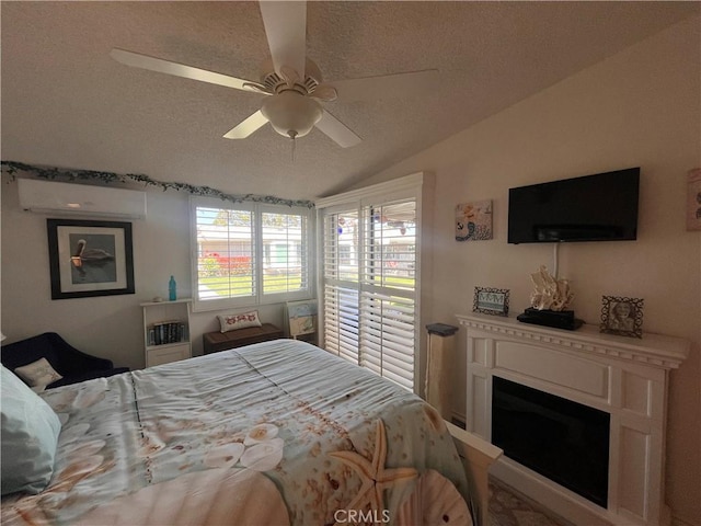 1271 Kenwood Rd Unit M7-J, Seal Beach, CA 90740 - bedroom with a wall mounted air conditioner, a textured ceiling, vaulted ceiling, a fireplace, and a ceiling fan