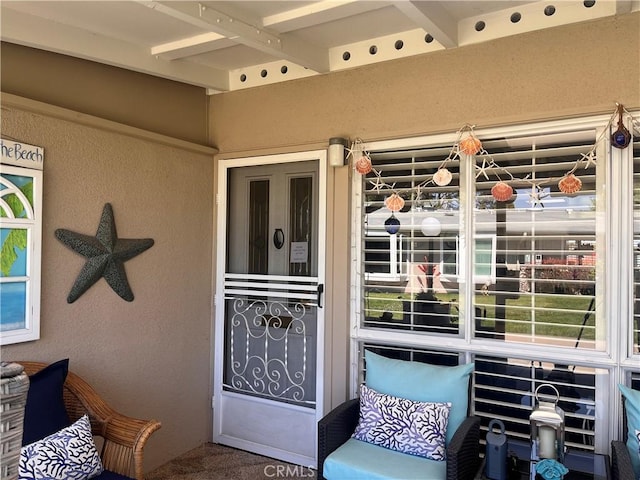 1271 Kenwood Rd Unit M7-J, Seal Beach, CA 90740 - view of exterior entry featuring stucco siding