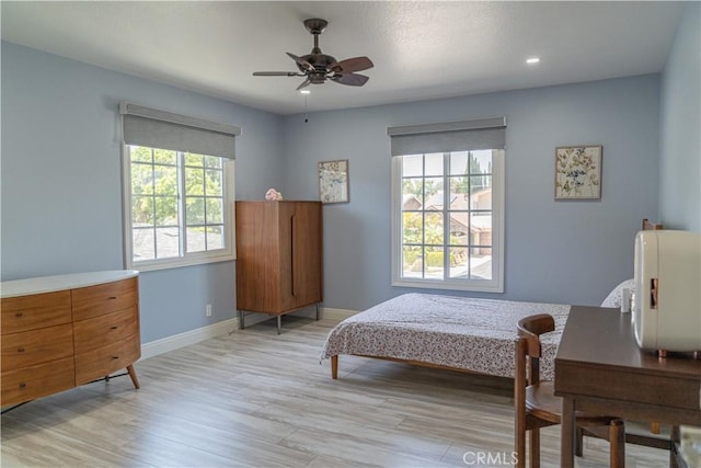 1845 Anaheim Ave Unit 27, Costa Mesa, CA 92627 - bedroom with light wood-style flooring, recessed lighting, and a ceiling fan