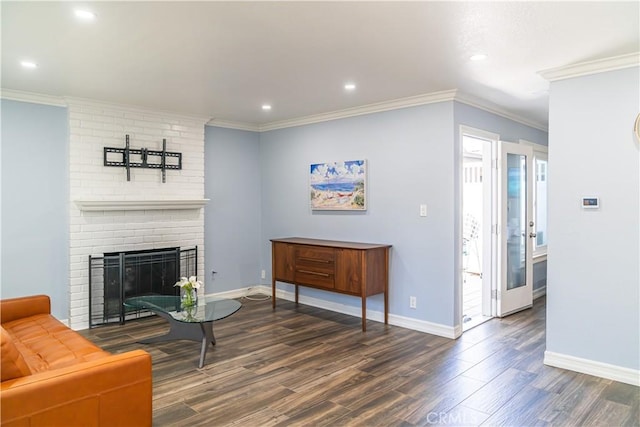 1845 Anaheim Ave Unit 27, Costa Mesa, CA 92627 - living room with wood finished floors, recessed lighting, a brick fireplace, and ornamental molding