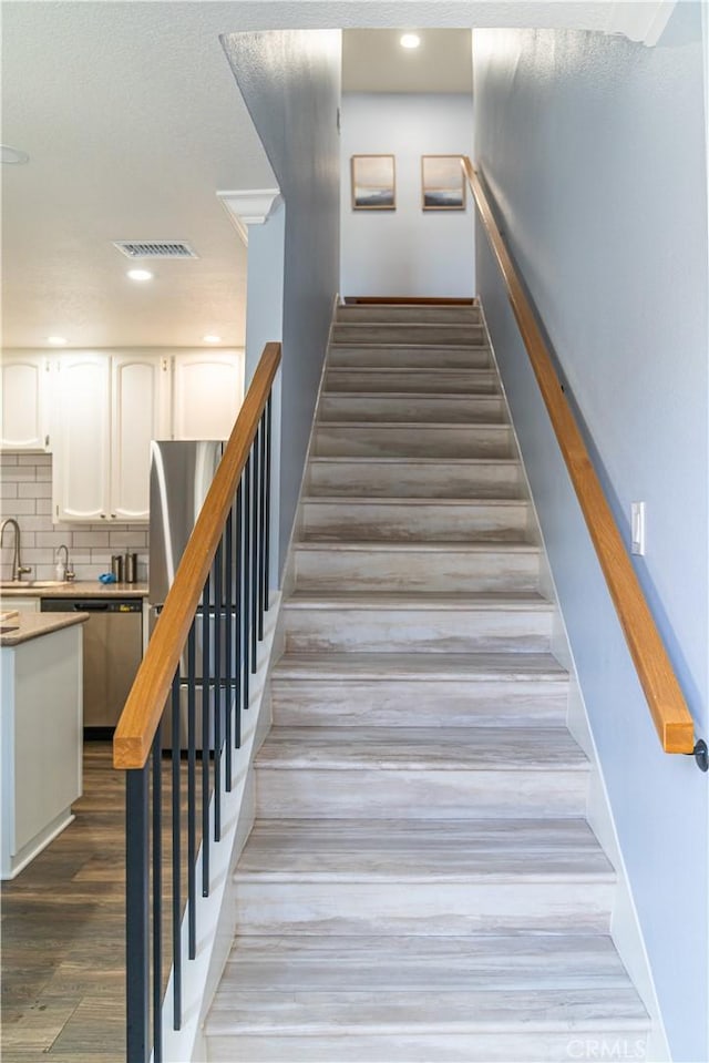 1845 Anaheim Ave Unit 7D, Costa Mesa, CA 92627 - stairway featuring wood finished floors and recessed lighting