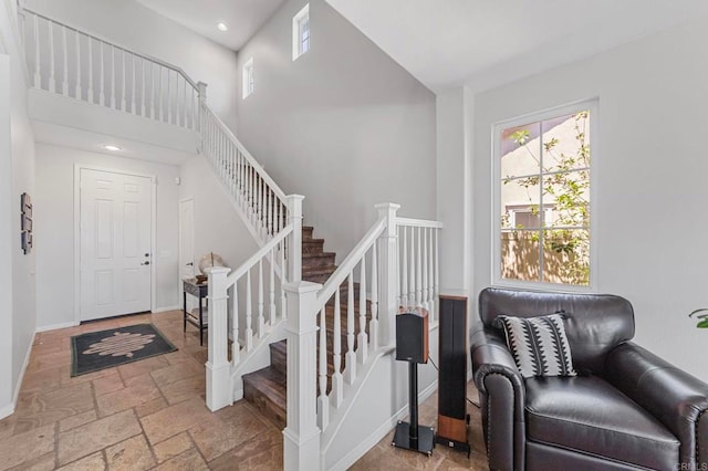 27792 Elderberry St, Murrieta, CA 92562 - foyer entrance with stone tile floors, stairway, recessed lighting, and a high ceiling