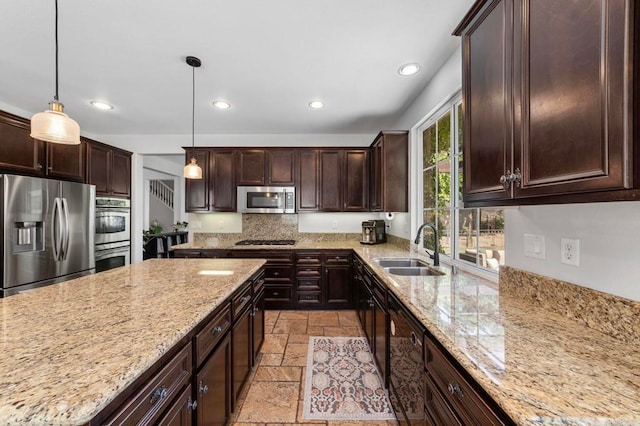 27792 Elderberry St, Murrieta, CA 92562 - kitchen featuring appliances with stainless steel finishes, stone tile flooring, recessed lighting, dark brown cabinets, and backsplash