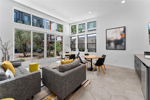 206 Alamo Ct, Long Beach, CA 90802 - living room with recessed lighting, plenty of natural light, and a towering ceiling